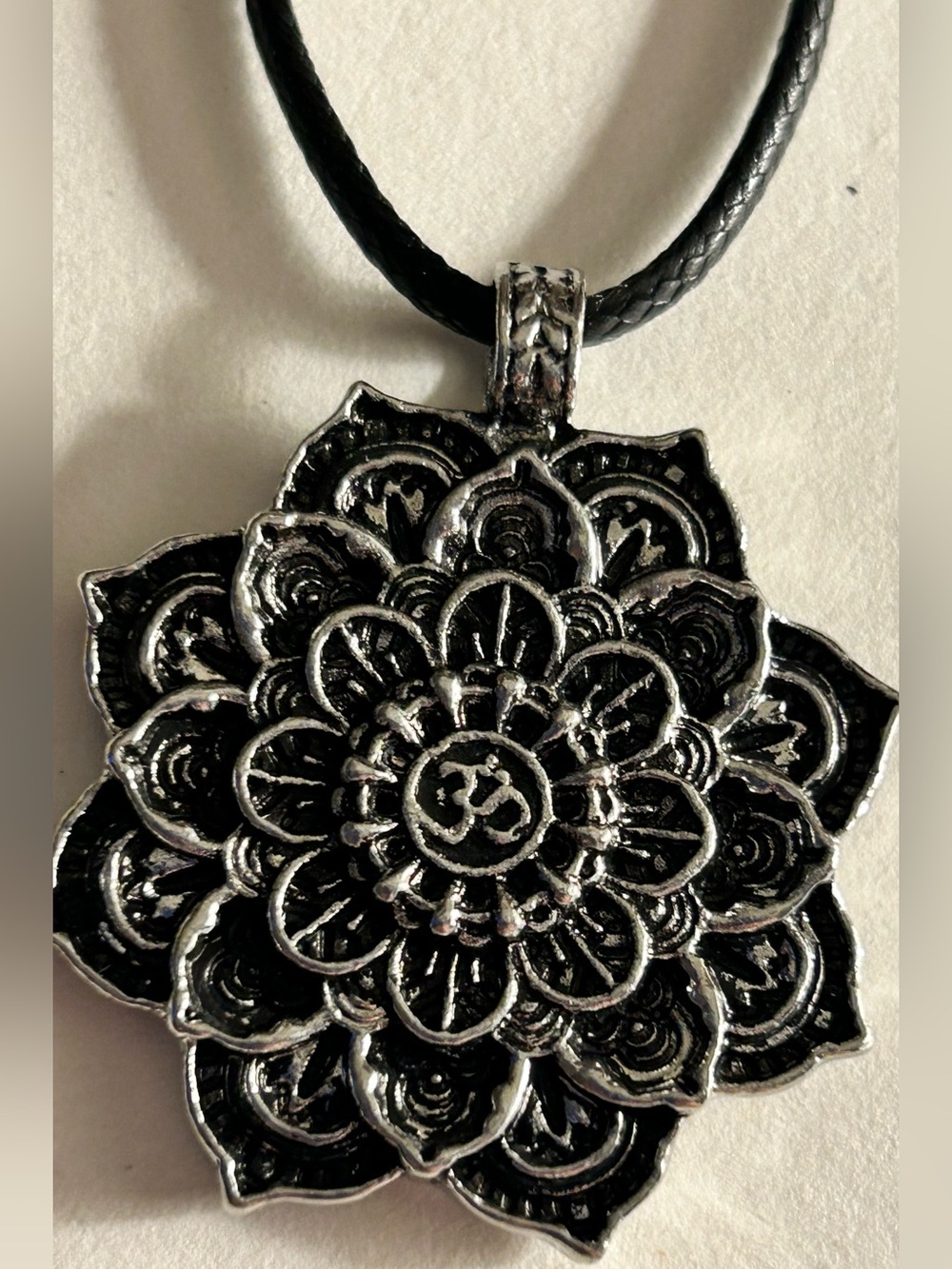 ADD 1 💰FREE 🆓/BUNDLE NWOT OM silver flower pendant 1.5”, black waxed 22” cord